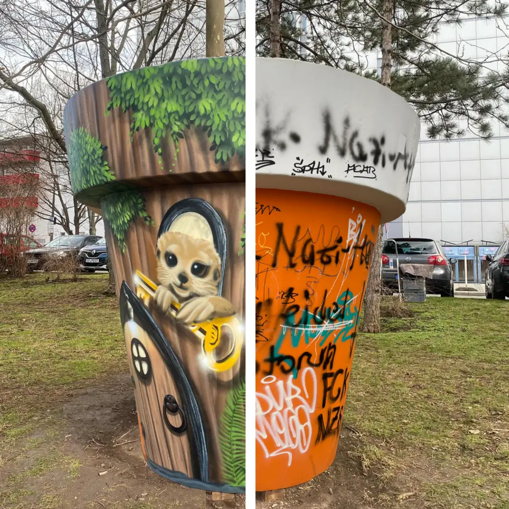Zwei Pflanzkübel, einer bemalt, der andere mit Graffiti beschmiert